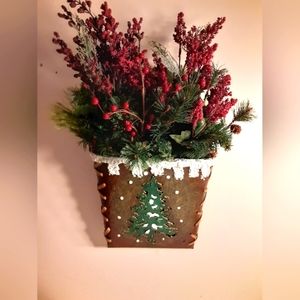 Xmas metal wall sconce with evergreen and berry arrangement
